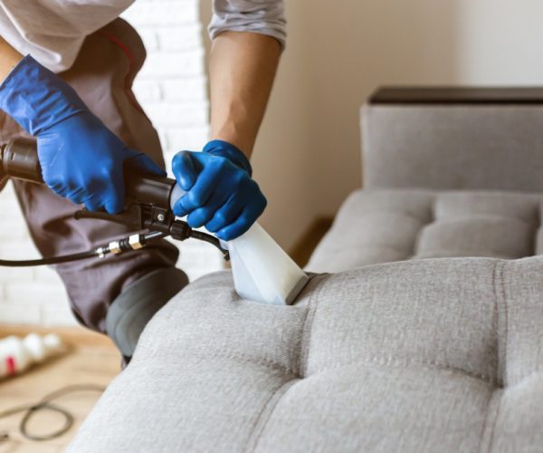 Man,Dry,Cleaner's,Employee,Hand,In,Protective,Rubber,Glove,Cleaning