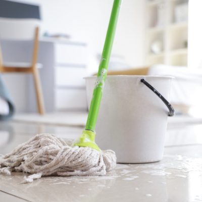 Wet,Mop,With,Bucket,On,Floor,In,Dorm,Room,,Closeup